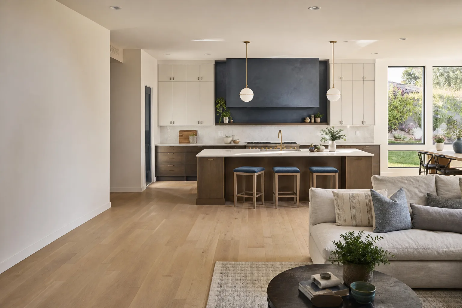 A remodeled open kitchen with a wood island and a painted range wall